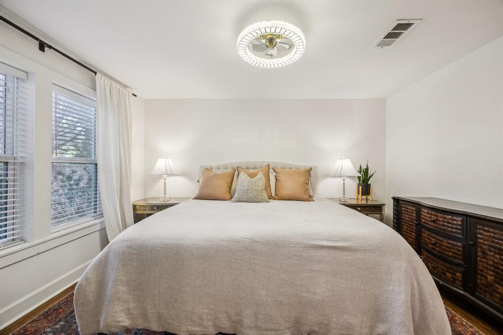 1227 Lansford Avenue Dallas, TX 75224 - Photo 8 of 17 a bedroom with a bed and a window