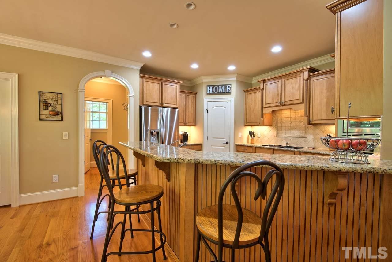 1 Springtree Circle Durham, NC 27712 - Photo 12 of 25 Everyone loves sitting at the bar! It also makes a great serving area when entertaining.