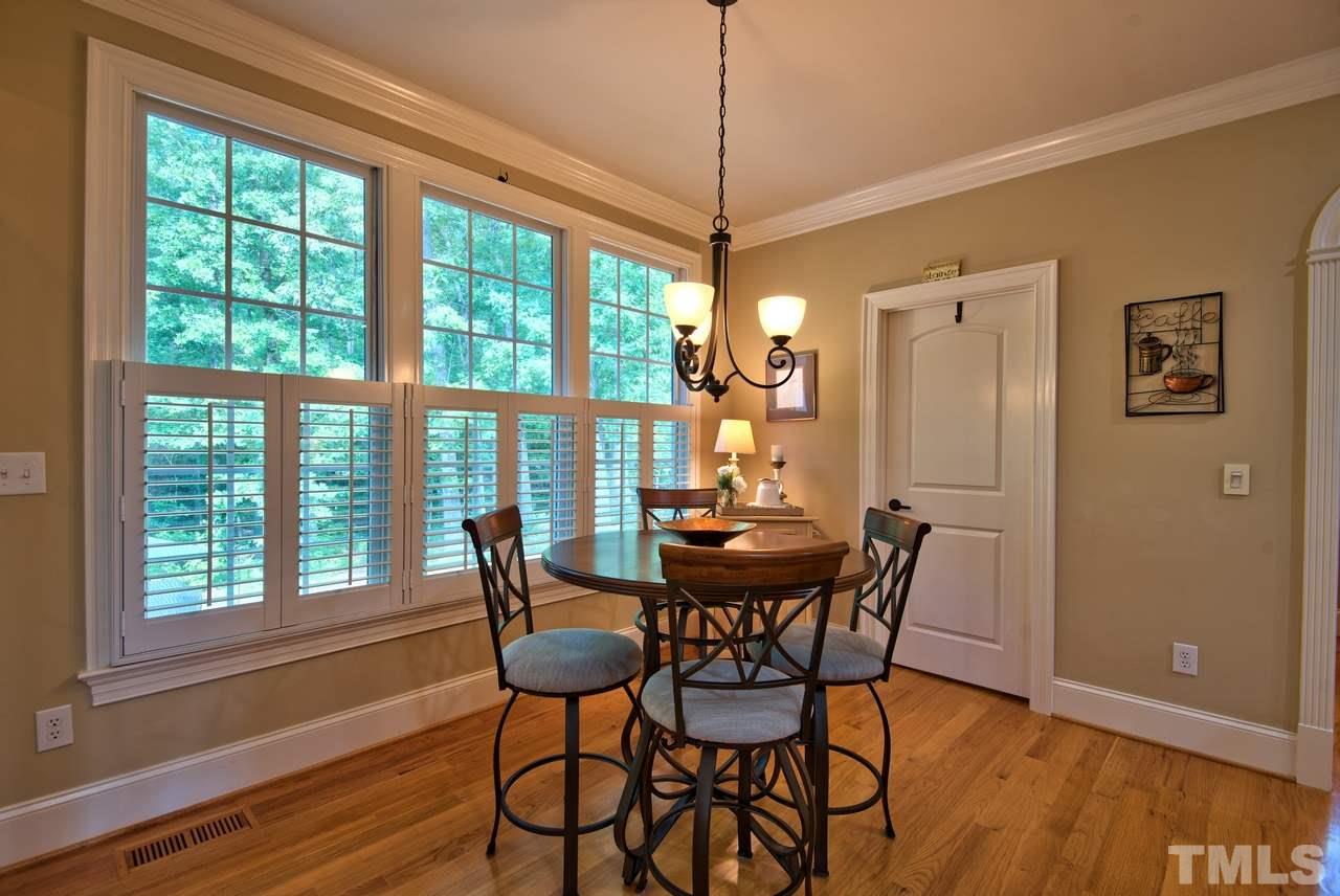 1 Springtree Circle Durham, NC 27712 - Photo 13 of 25 The Breakfast area is the perfect place to enjoy a meal and a view of the backyard.