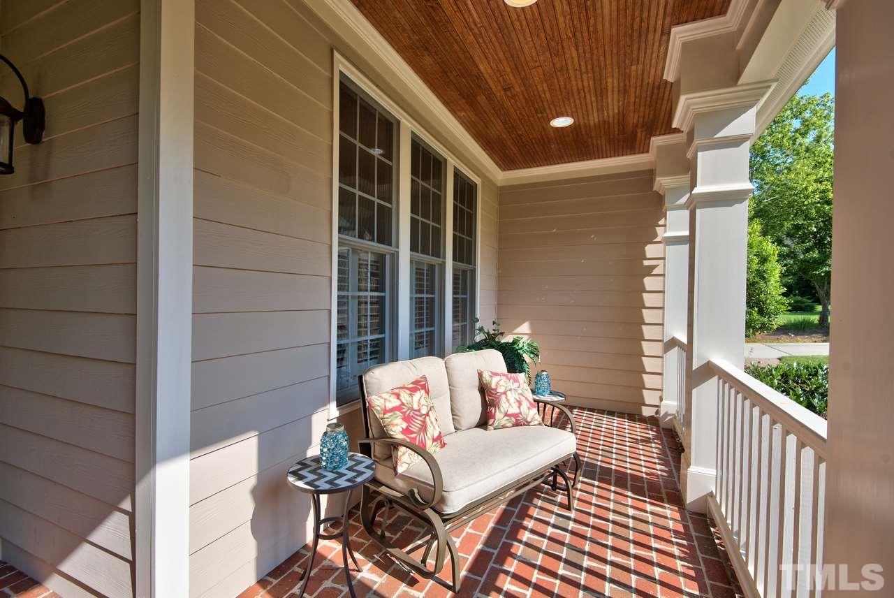 1 Springtree Circle Durham, NC 27712 - Photo 3 of 25 The Covered Front Porch will greet you and your guest with a brick floor, bead board ceiling and recessed lighting. Spacious enough for furniture and plants!