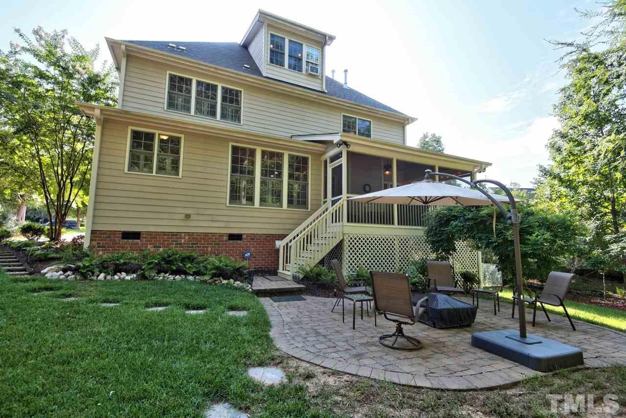 1 Springtree Circle Durham, NC 27712 - Photo 24 of 25 The backyard has a paver patio and backs up the trees. It feels private.