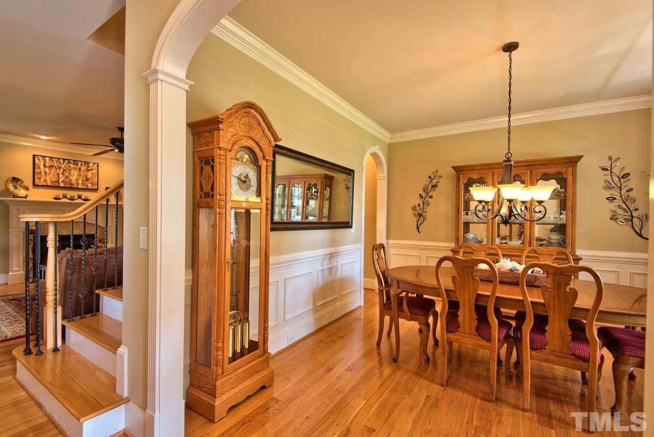 1 Springtree Circle Durham, NC 27712 - Photo 5 of 25 The Dining Room has a lovely arched entry, crown molding, trim work and good natural lighting.