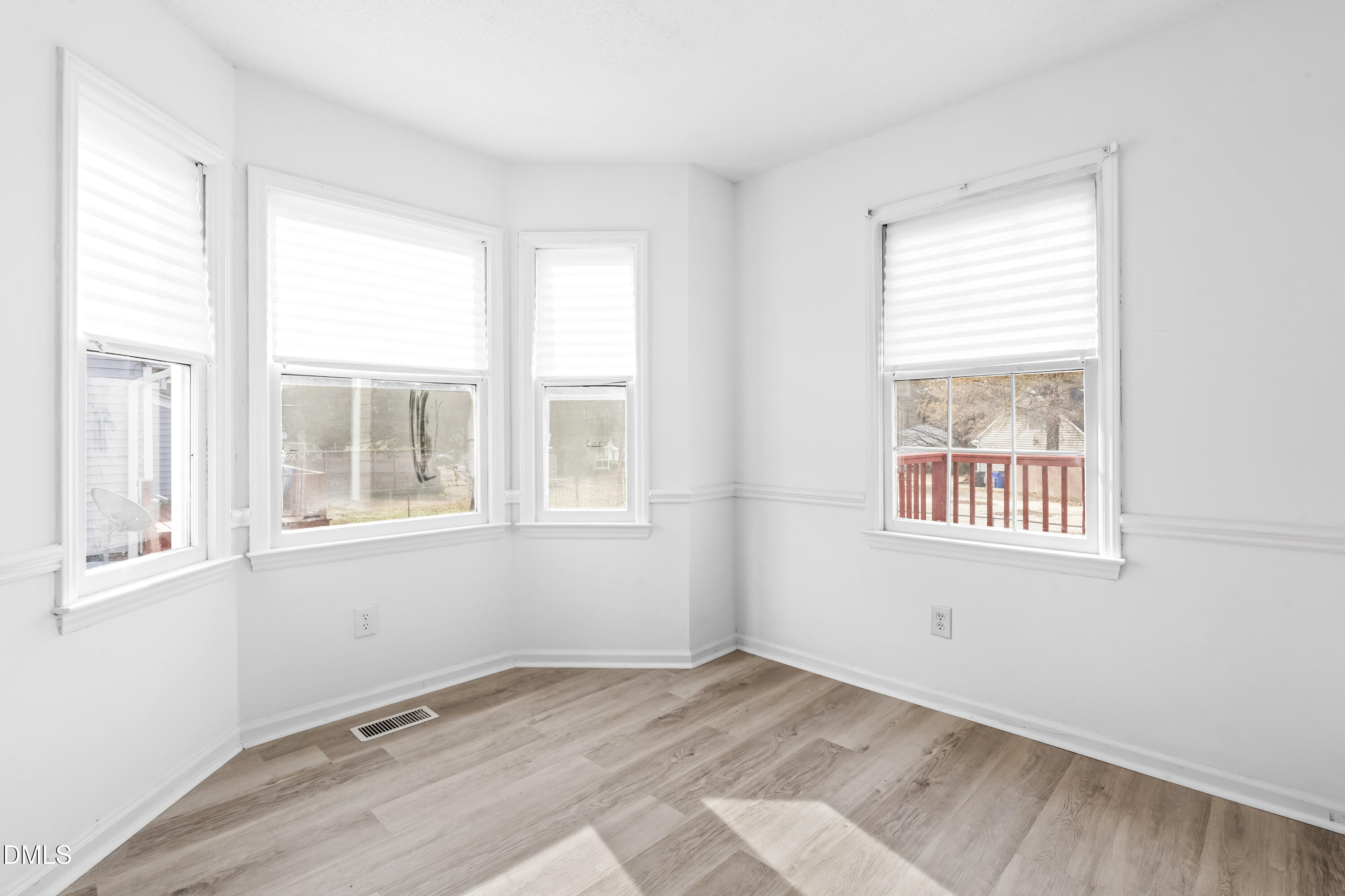8029 Perry Creek Road Raleigh, NC 27616 - Photo 14 of 27 an empty room with a window