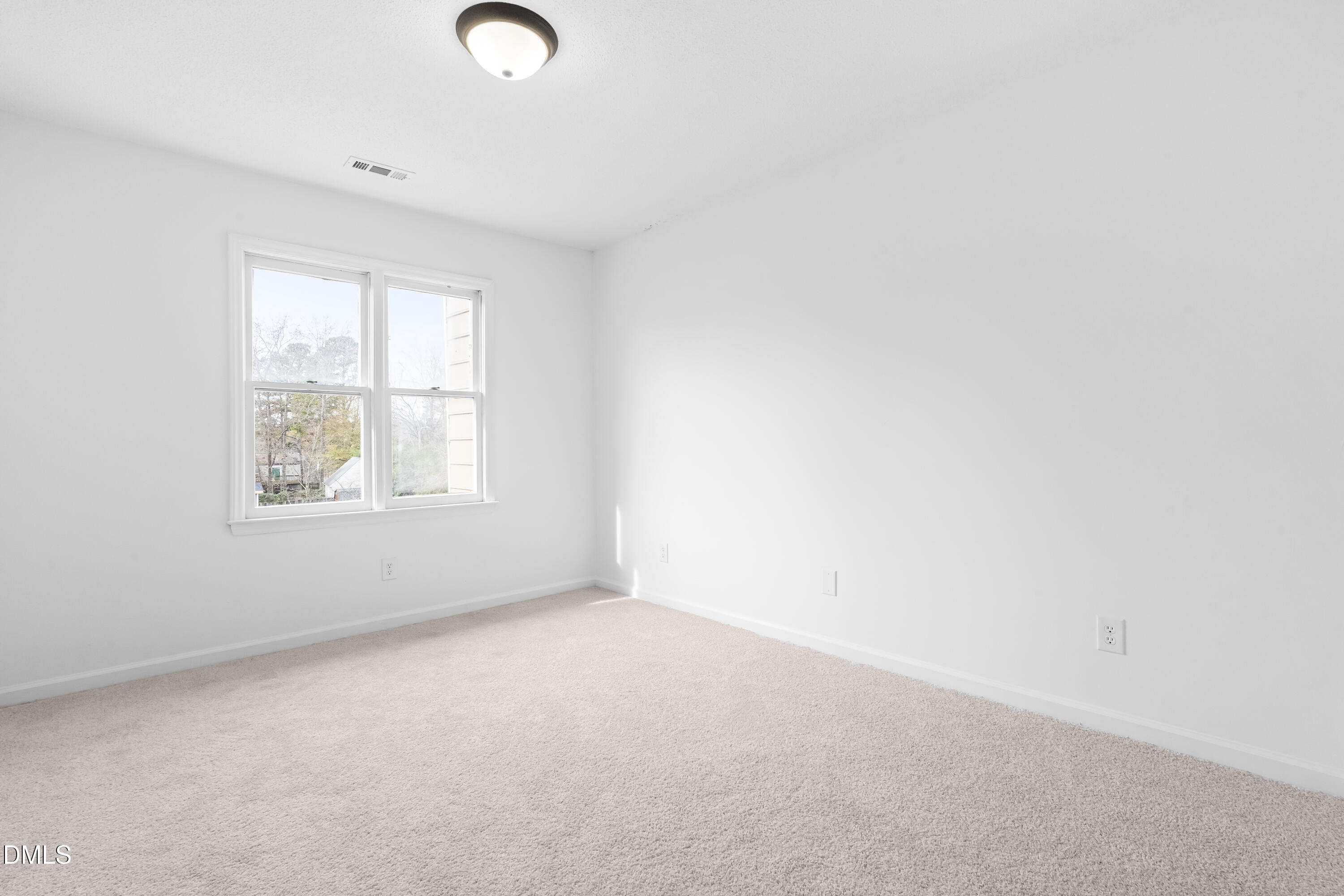 8029 Perry Creek Road Raleigh, NC 27616 - Photo 18 of 27 an empty room with windows