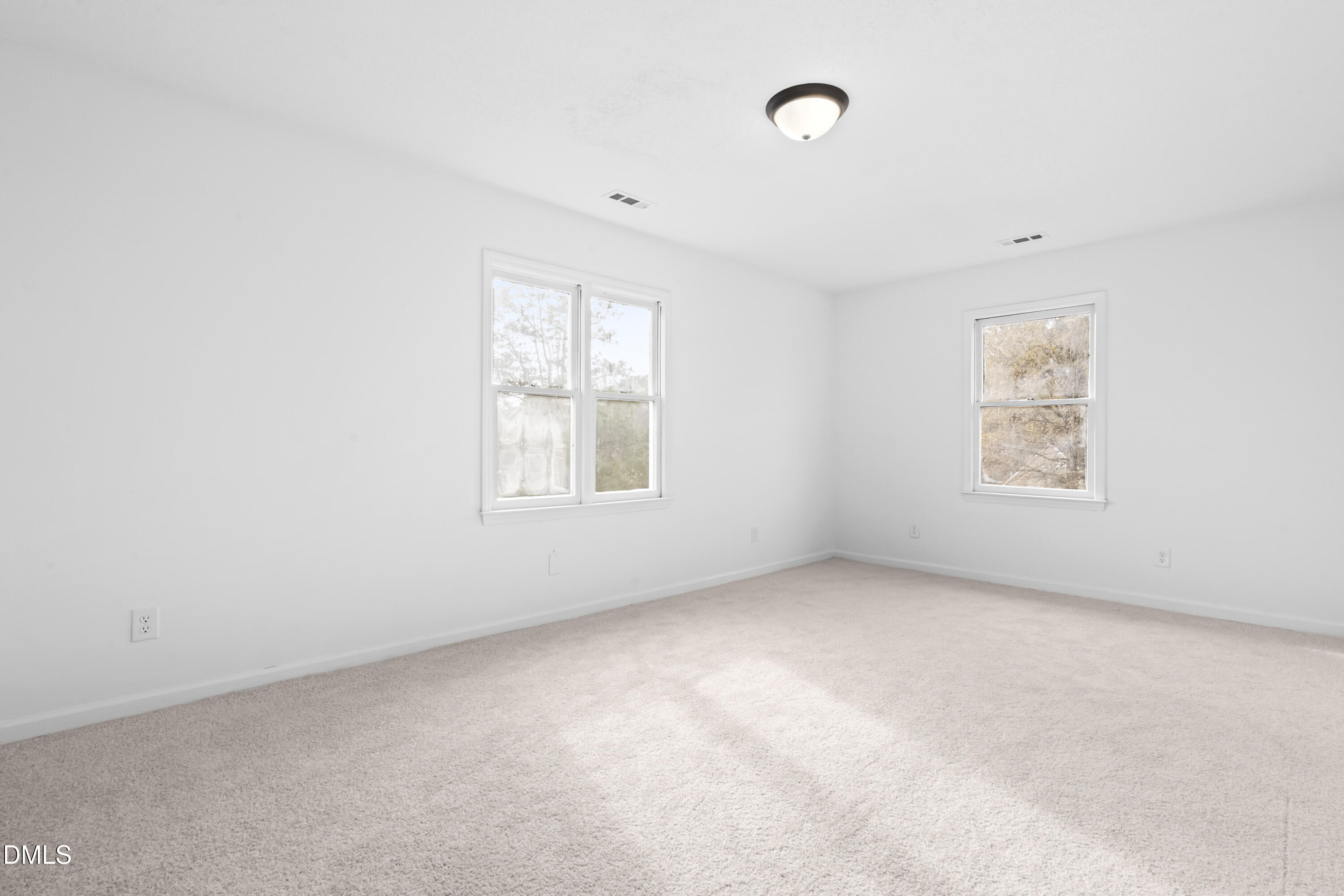 8029 Perry Creek Road Raleigh, NC 27616 - Photo 20 of 27 an empty room with windows