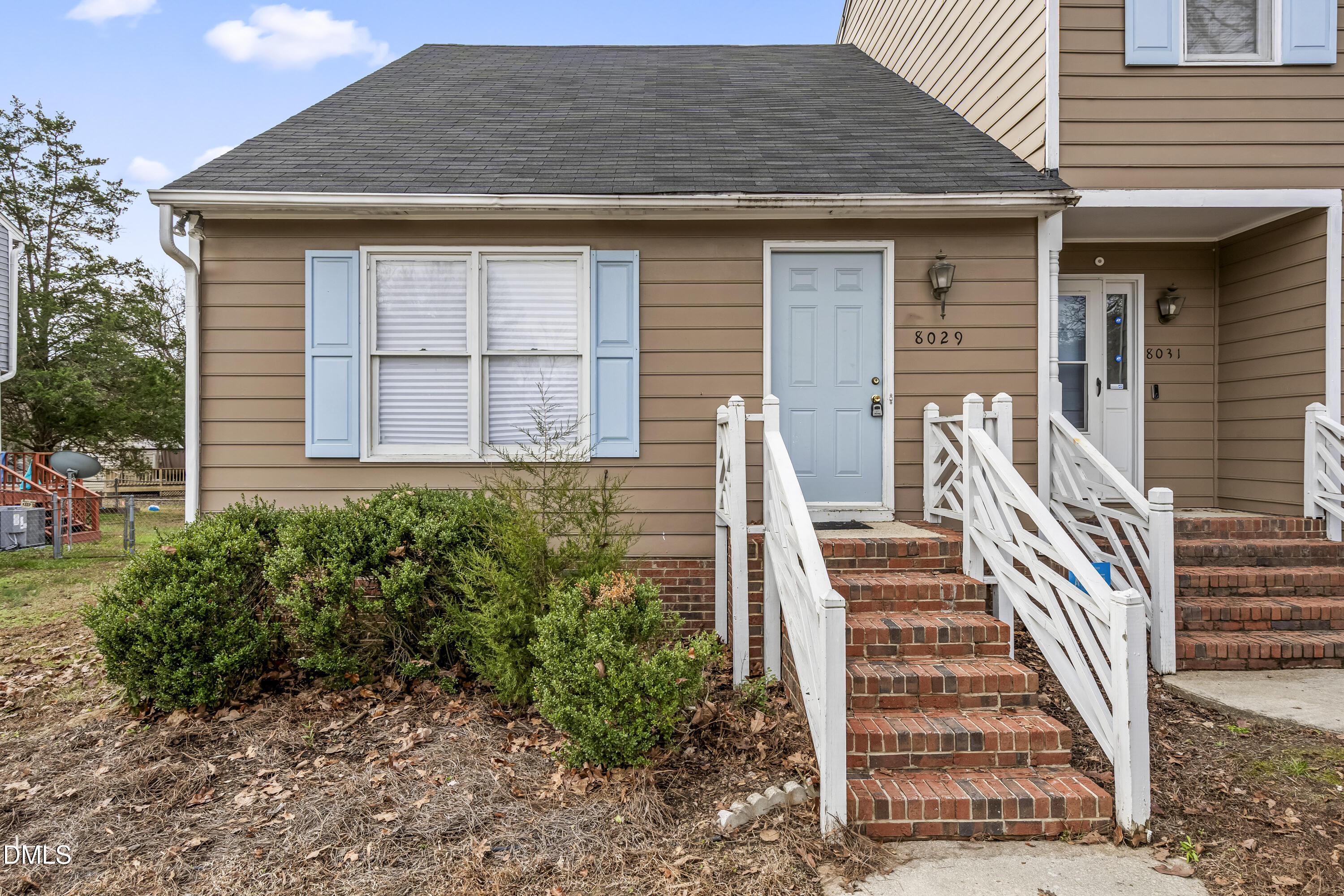 8029 Perry Creek Road Raleigh, NC 27616 - Photo 2 of 27 a front view of a house with stairs