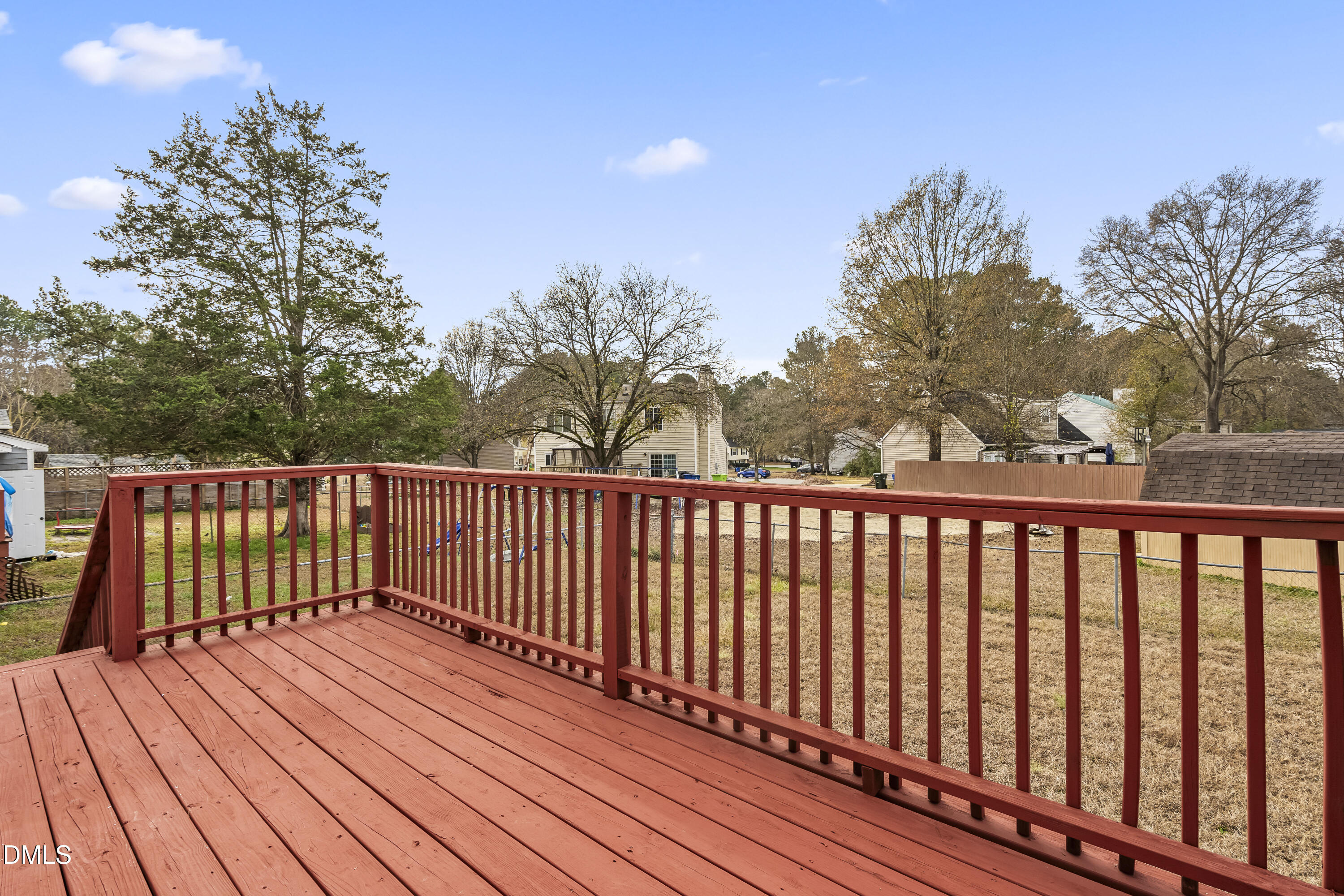 8029 Perry Creek Road Raleigh, NC 27616 - Photo 25 of 27 a balcony with wooden floor and fence