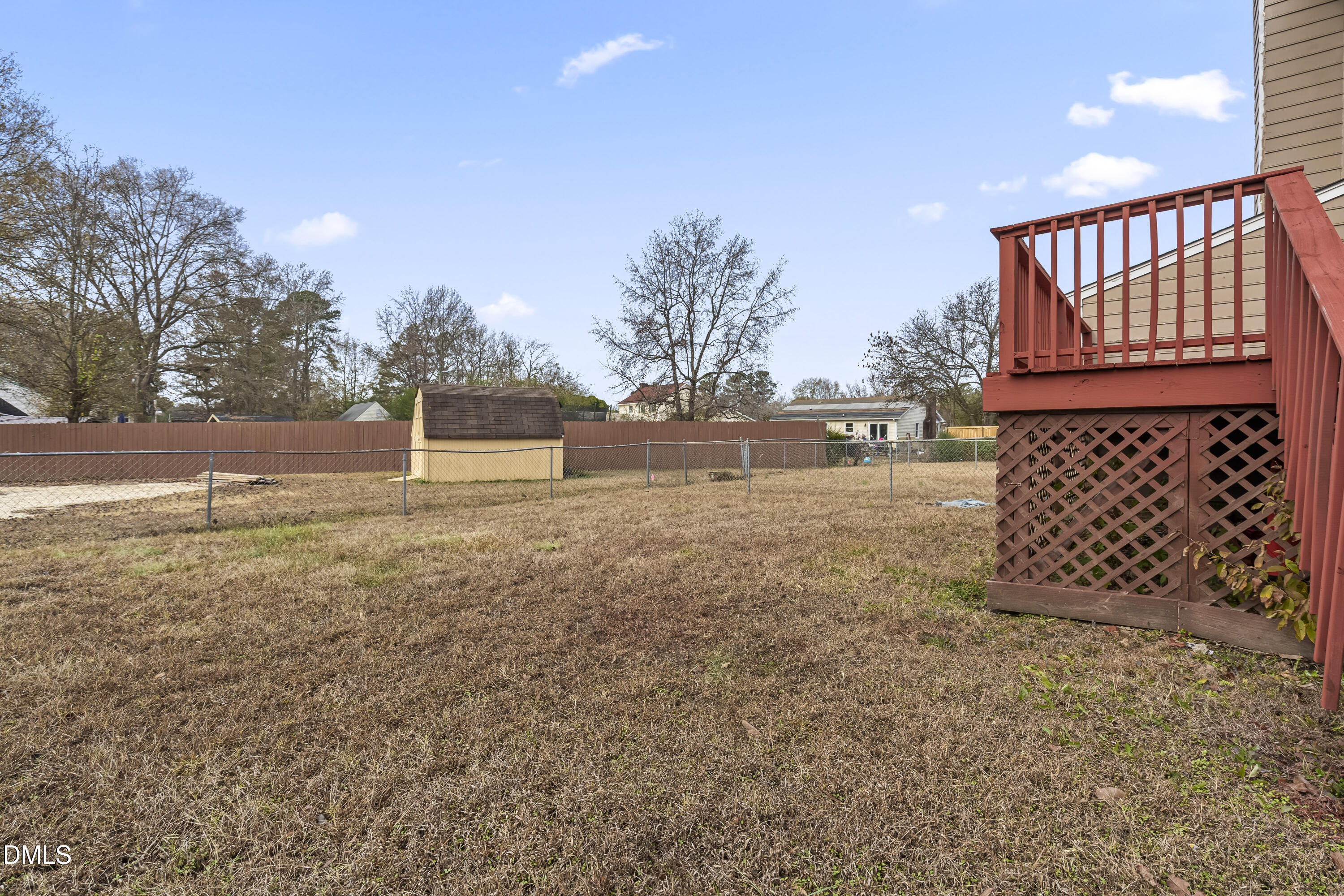 8029 Perry Creek Road Raleigh, NC 27616 - Photo 26 of 27 a backyard of a house with lots of green space