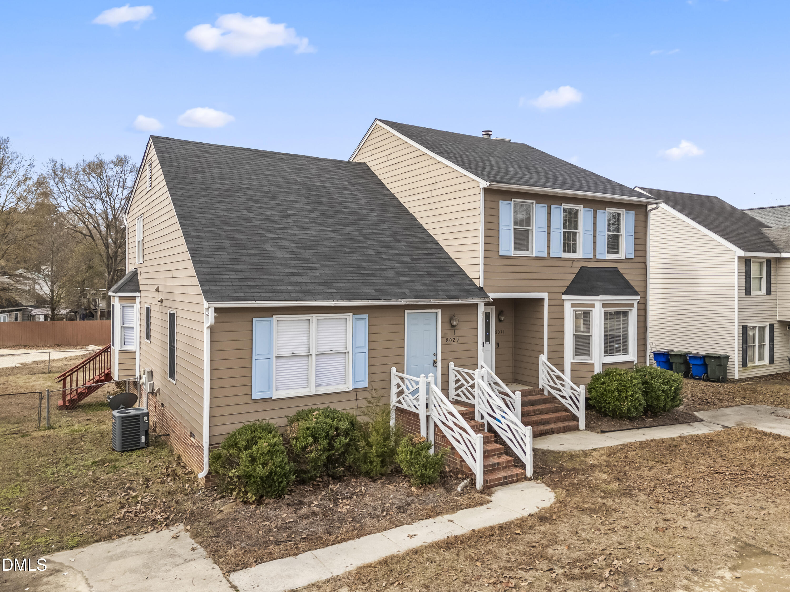 8029 Perry Creek Road Raleigh, NC 27616 - Photo 5 of 27 a front view of a house with garden