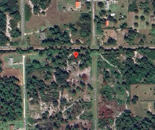 an aerial view of house with yard