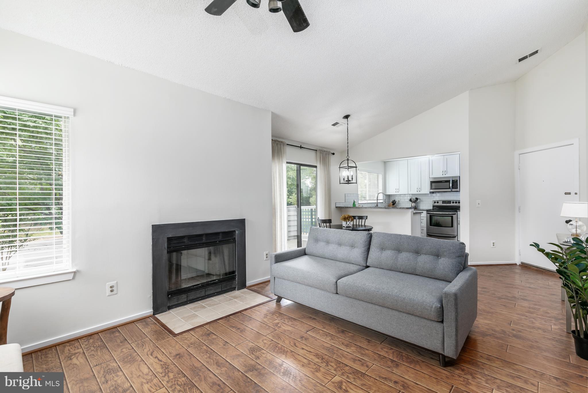 1504 Summerchase Court, Unit B Reston, VA 20194 - Photo 8 of 22 Living Room with cozy fireplace