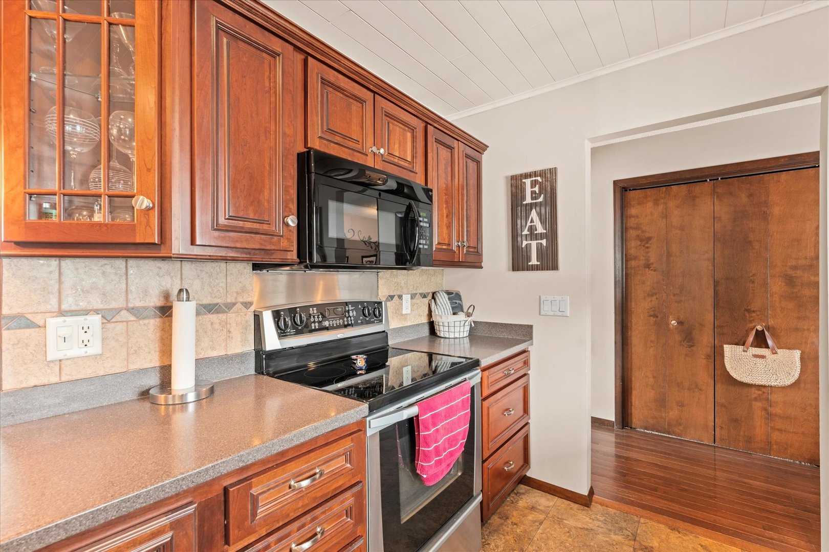 617 West 4th Street Homer, IL 61849 - Photo 17 of 42 a kitchen with stainless steel appliances granite countertop a stove a sink and a microwave