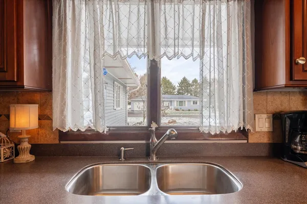 a kitchen with a sink and a window