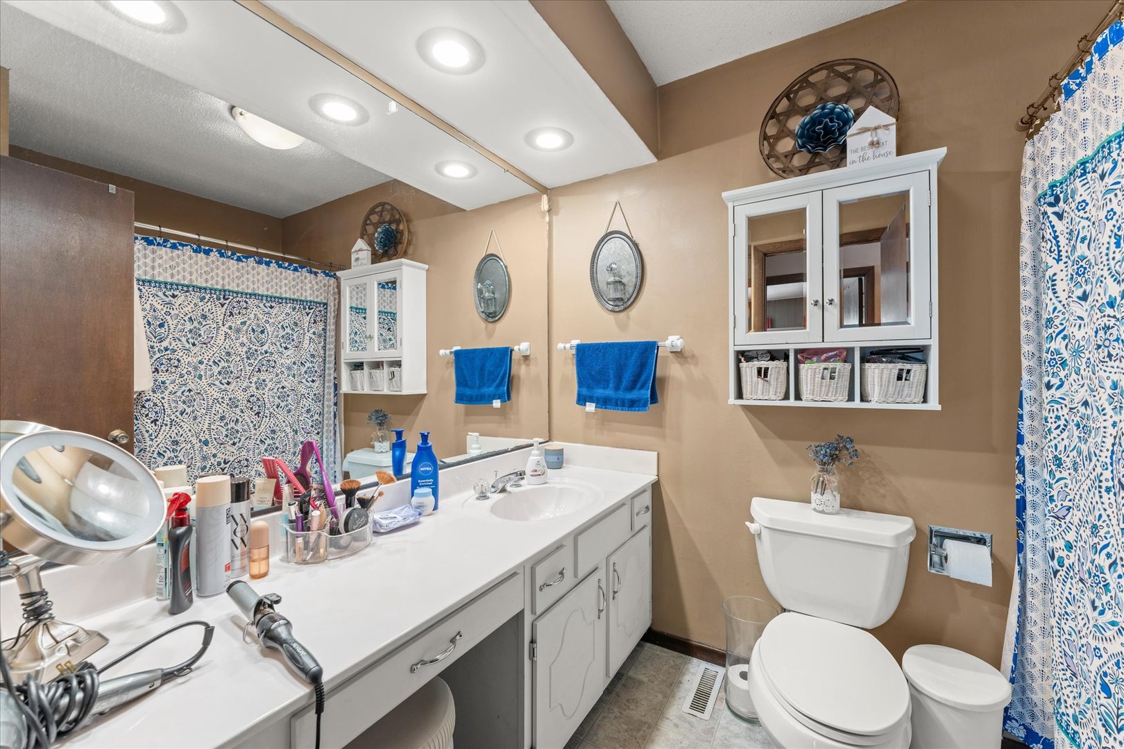 617 West 4th Street Homer, IL 61849 - Photo 22 of 42 a bathroom with a sink a toilet and a large mirror