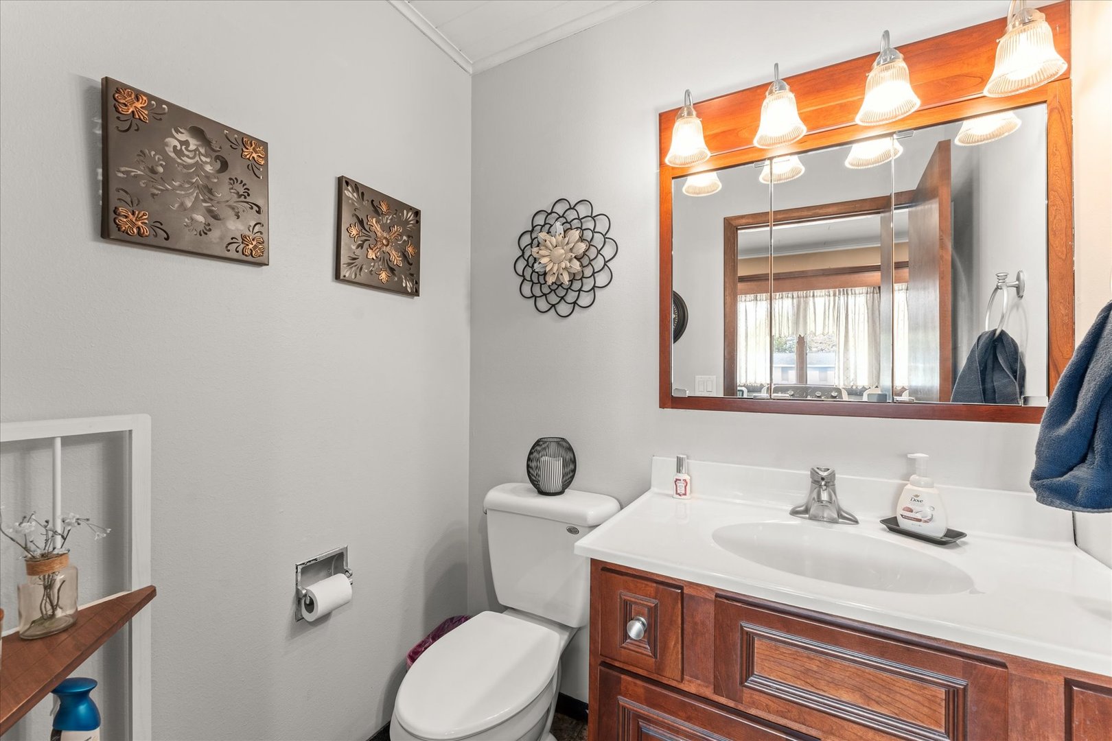 617 West 4th Street Homer, IL 61849 - Photo 29 of 42 a bathroom with a granite countertop toilet sink and mirror