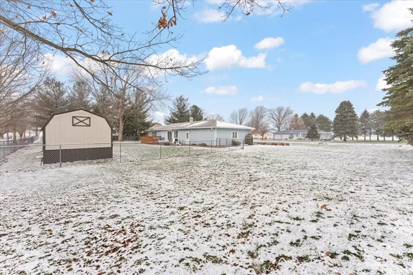 a view of a yard with a house