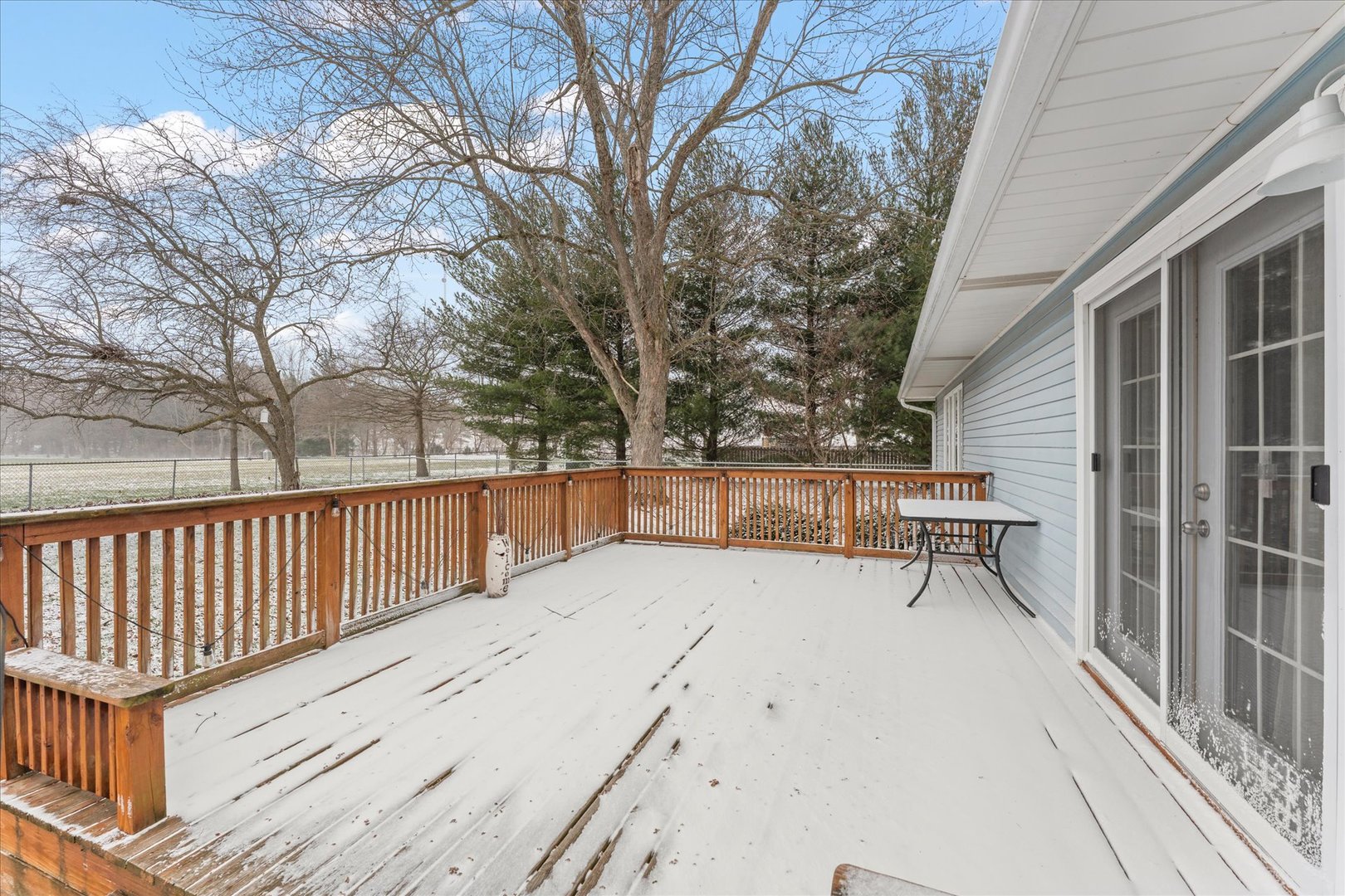617 West 4th Street Homer, IL 61849 - Photo 38 of 42 a view of wooden roof deck with wooden fence and trees
