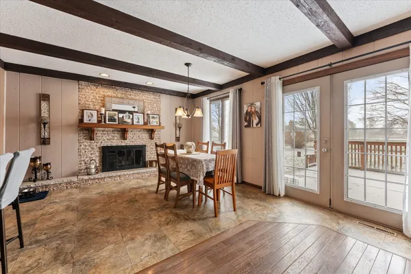 a view of a livingroom with furniture and a fireplace