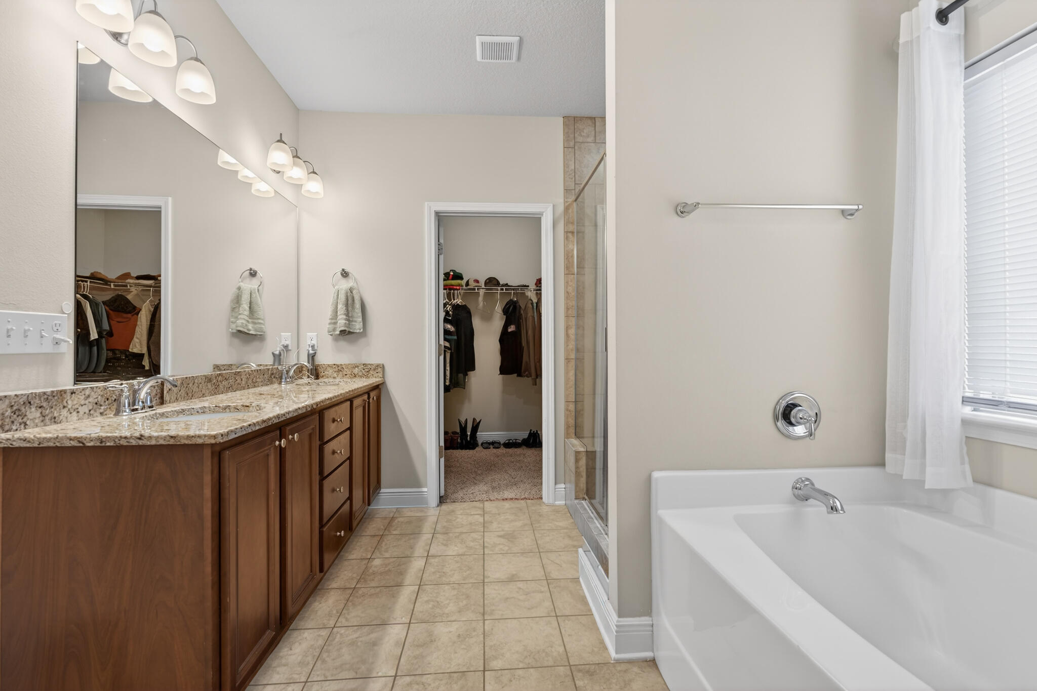511 Gadwell Street Crestview, FL 32539 - Photo 12 of 48 a bathroom with a tub sink and mirror