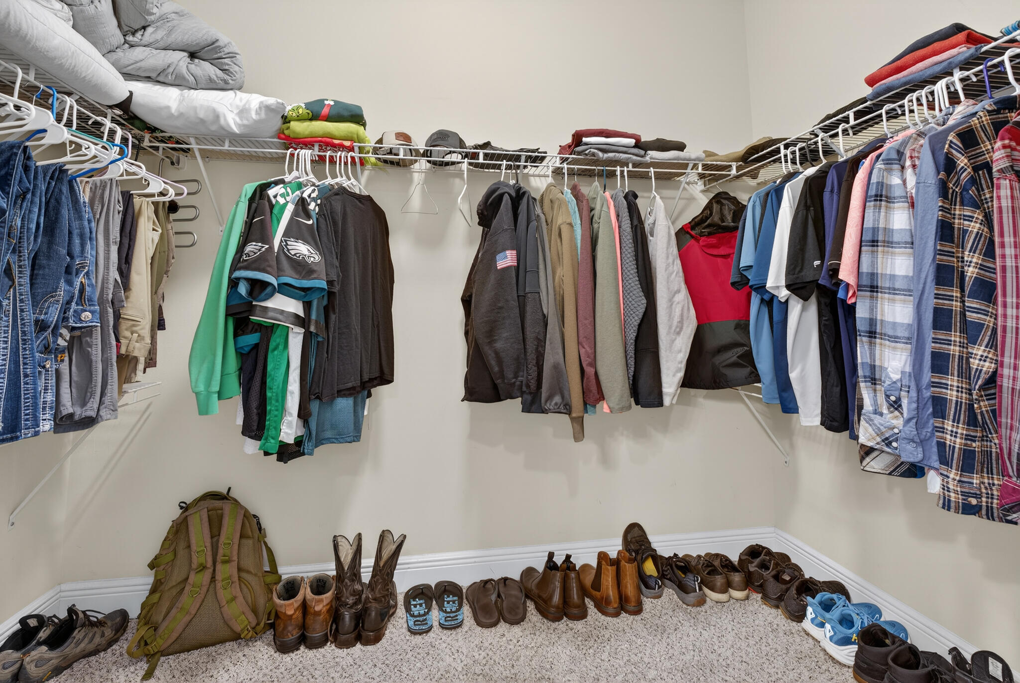 511 Gadwell Street Crestview, FL 32539 - Photo 15 of 48 a view of walk in closet with clothes and shoes