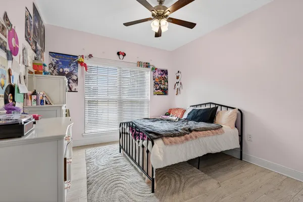a bedroom with bed and a window