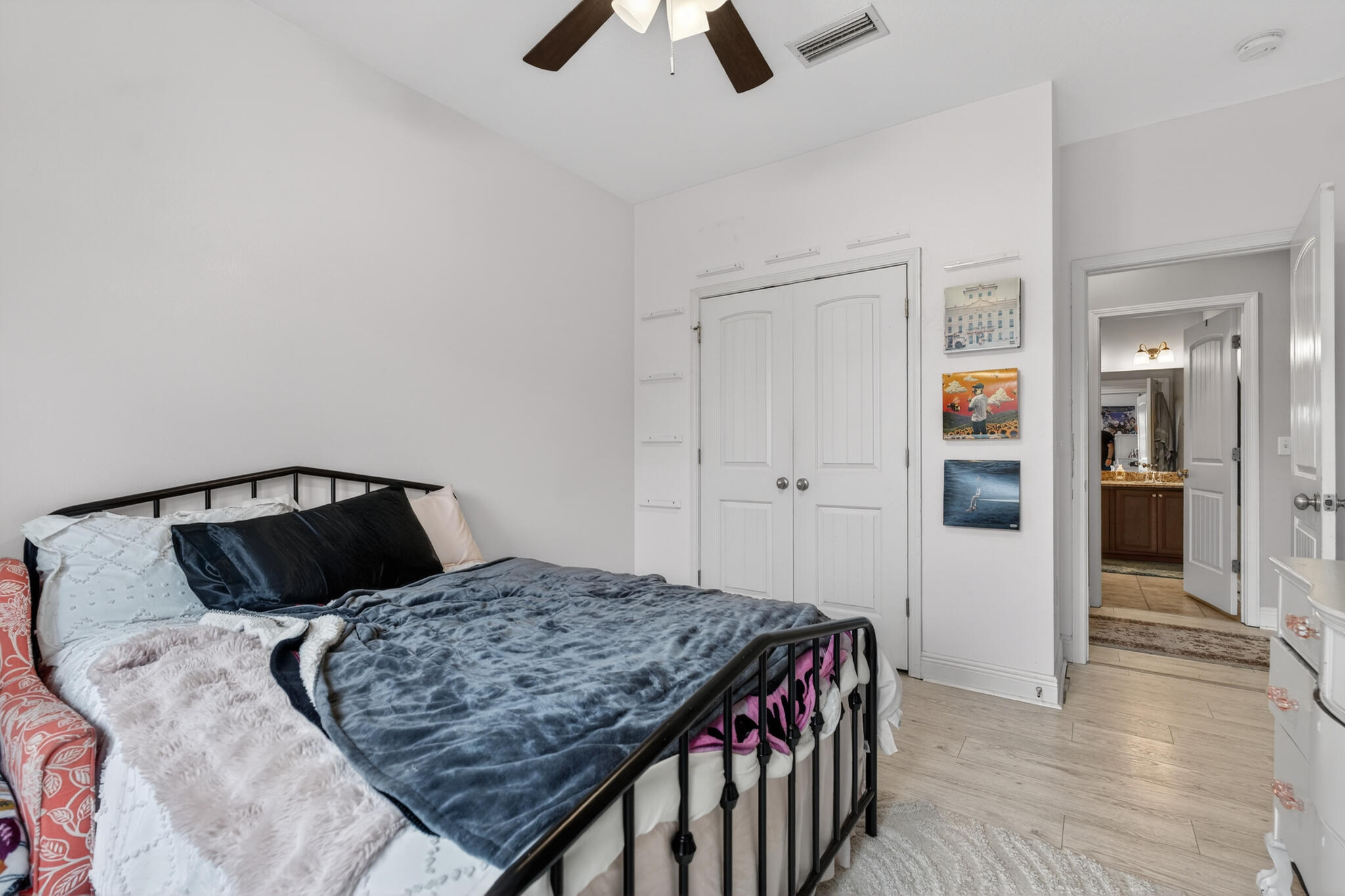 511 Gadwell Street Crestview, FL 32539 - Photo 17 of 48 a bedroom with a bed and wooden floor