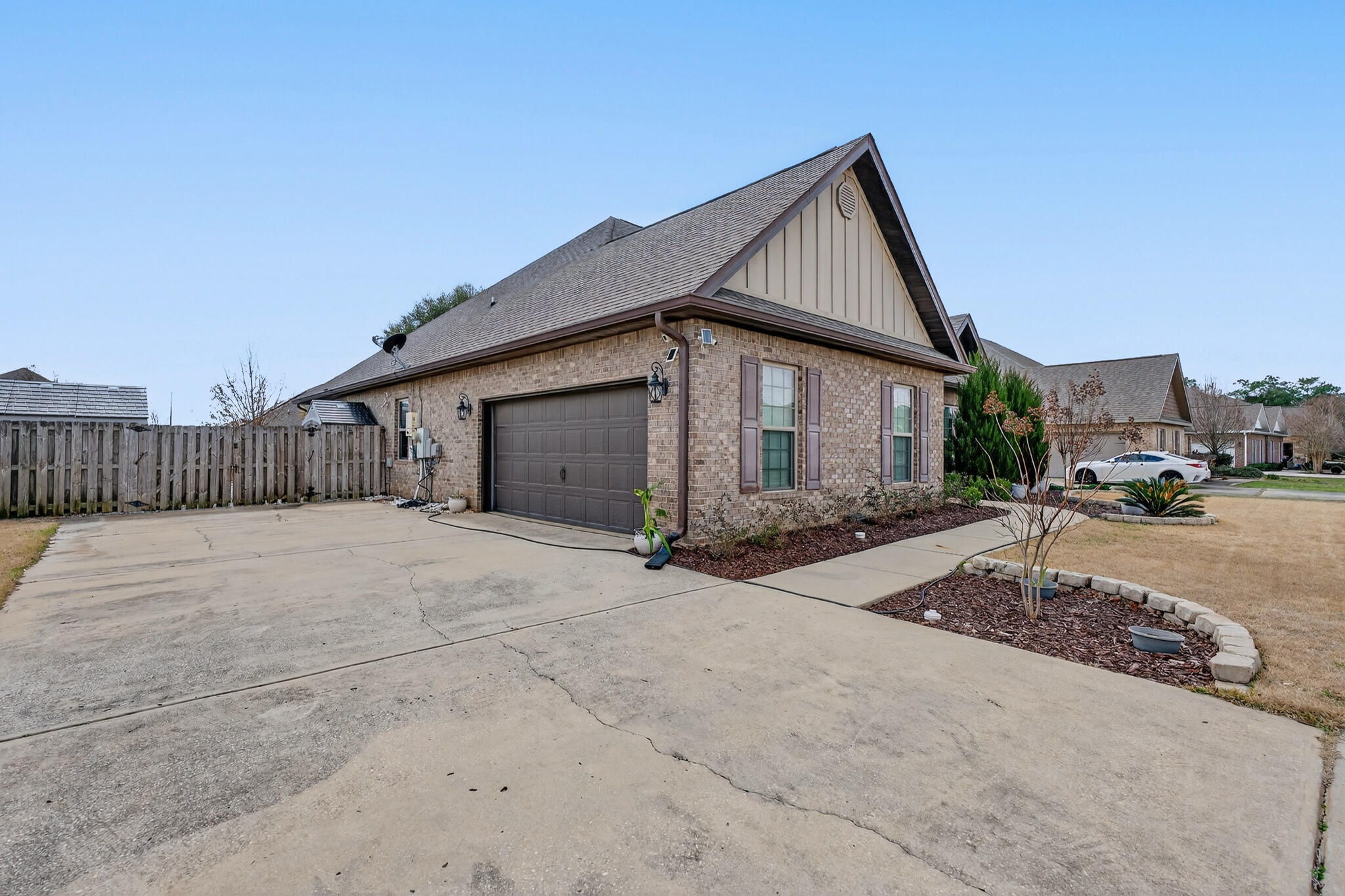511 Gadwell Street Crestview, FL 32539 - Photo 2 of 48 a front view of a house with a yard and garage