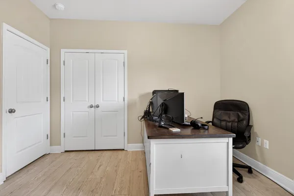 a view of workspace with wooden floor