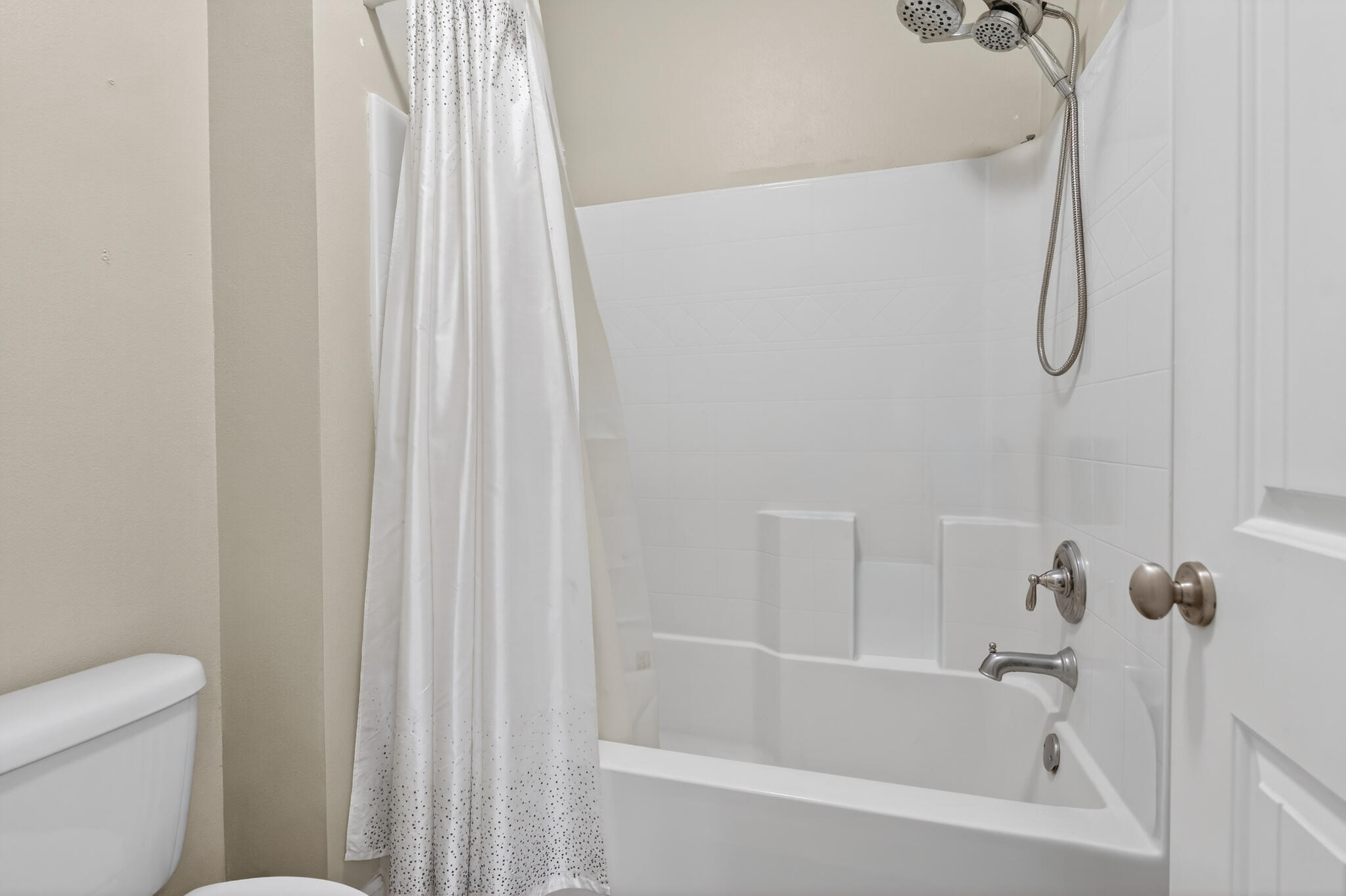 511 Gadwell Street Crestview, FL 32539 - Photo 24 of 48 a white bath tub with a shower curtain