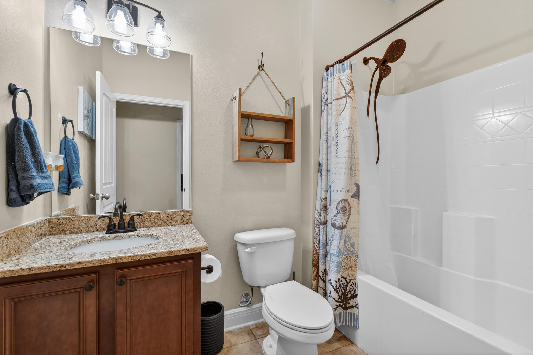 511 Gadwell Street Crestview, FL 32539 - Photo 26 of 48 a bathroom with a granite countertop sink toilet and shower