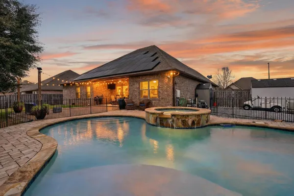 a view of a swimming pool with lounge chair