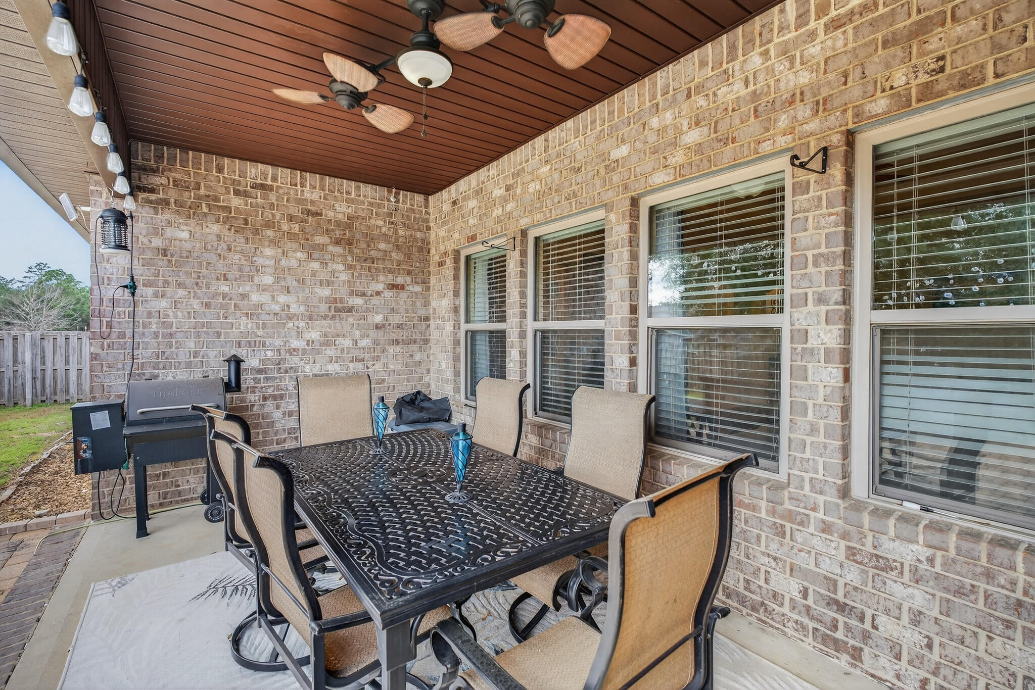 511 Gadwell Street Crestview, FL 32539 - Photo 33 of 48 a view of a patio with a table and chairs