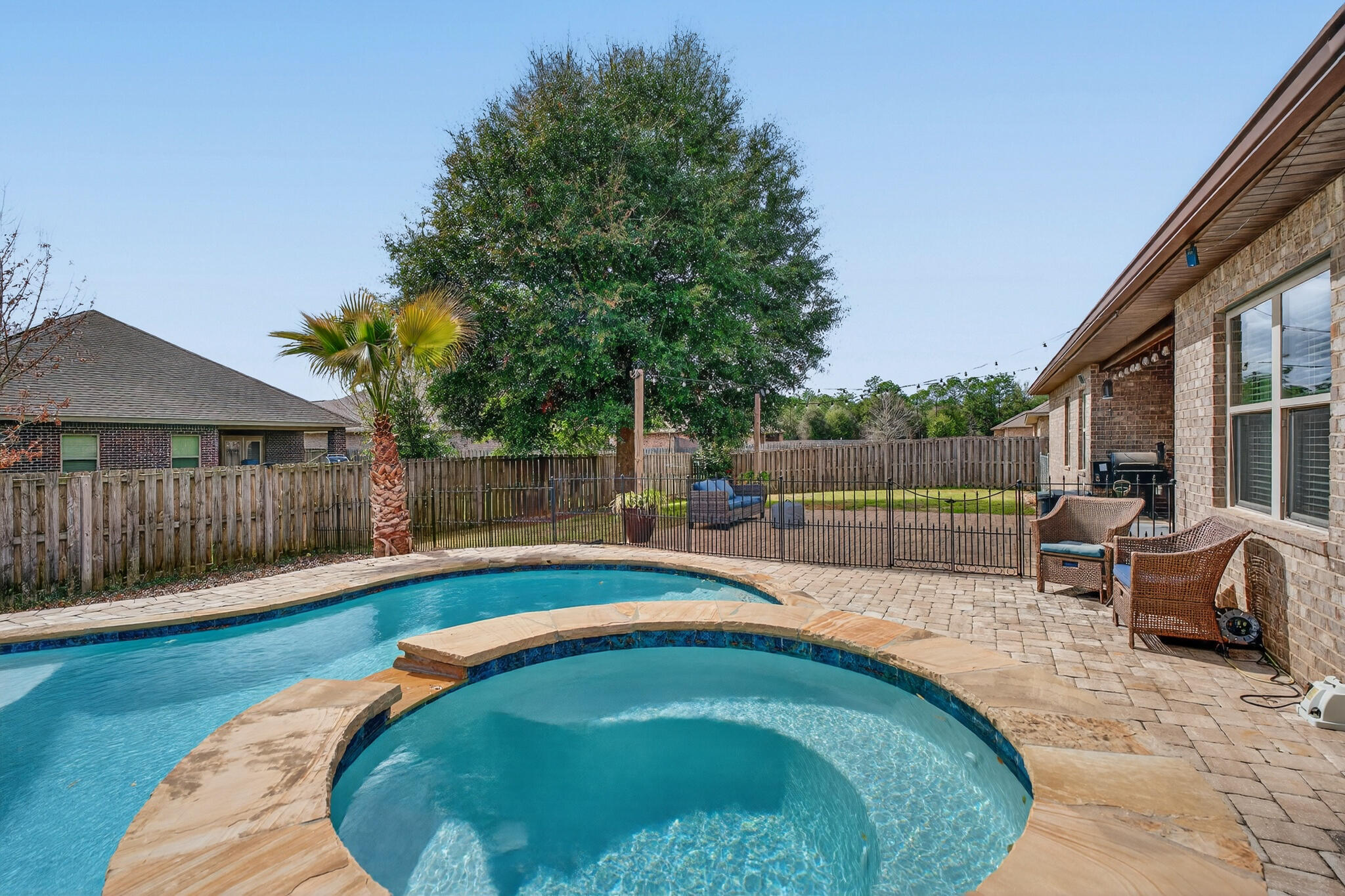 511 Gadwell Street Crestview, FL 32539 - Photo 40 of 48 a swimming pool with wooden fence