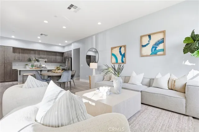 a view of a house with a garden and pathway