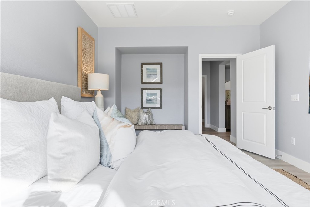 67 Promesa Avenue Rancho Mission Viejo, CA 92694 - Photo 21 of 75 a bedroom with a bed and a lamp