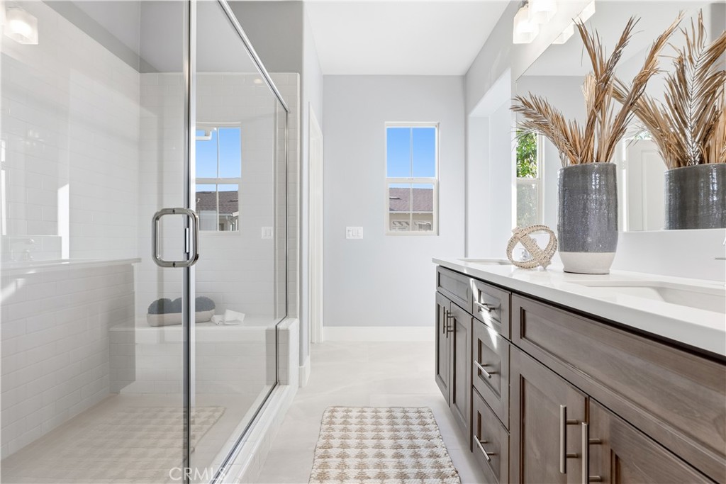 67 Promesa Avenue Rancho Mission Viejo, CA 92694 - Photo 24 of 75 a bathroom with a sink a mirror and a shower