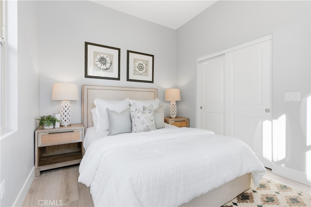 67 Promesa Avenue Rancho Mission Viejo, CA 92694 - Photo 31 of 75 a bedroom with a bed and a painting on the wall