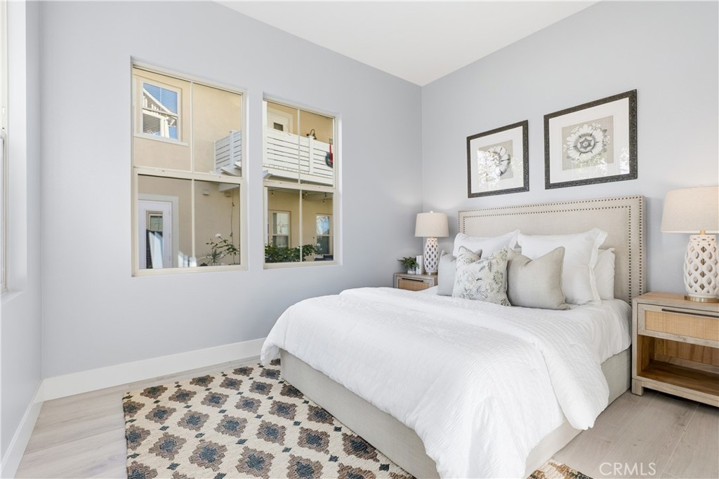 67 Promesa Avenue Rancho Mission Viejo, CA 92694 - Photo 32 of 75 a bedroom with a large bed and a window