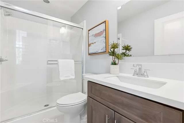 an aerial view of residential house and sandy dunes