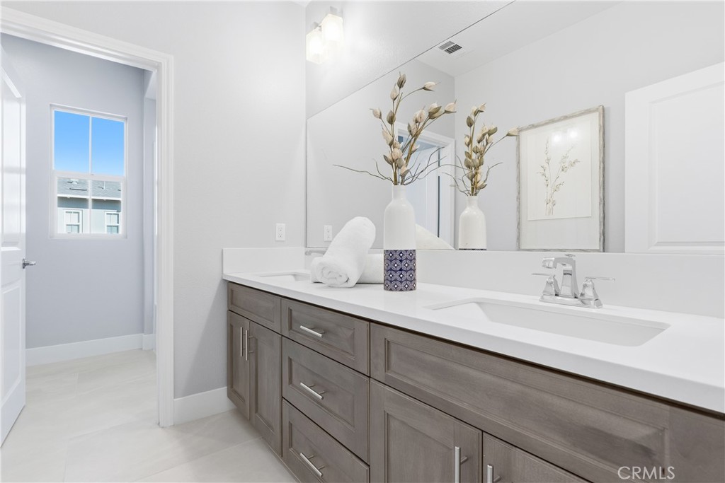 67 Promesa Avenue Rancho Mission Viejo, CA 92694 - Photo 41 of 75 a bathroom with a double vanity sink and a mirror