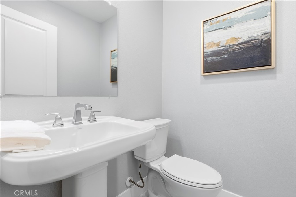 67 Promesa Avenue Rancho Mission Viejo, CA 92694 - Photo 44 of 75 a bathroom with a toilet a sink and mirror