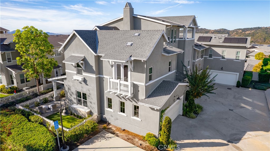 67 Promesa Avenue Rancho Mission Viejo, CA 92694 - Photo 46 of 75 a aerial view of a house with a yard and potted plants
