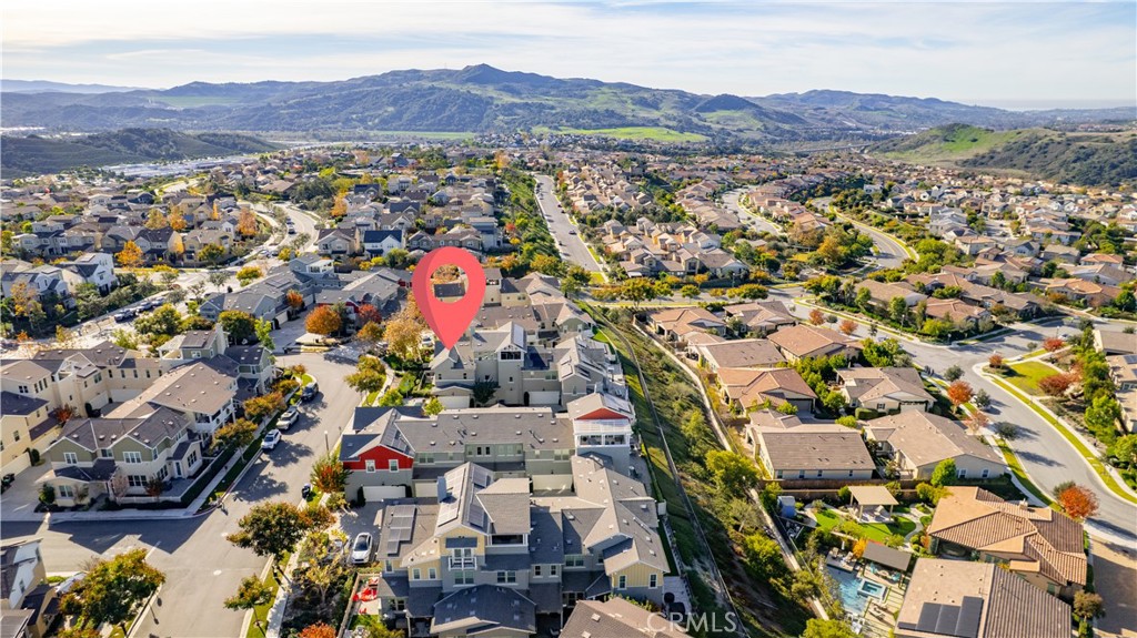 67 Promesa Avenue Rancho Mission Viejo, CA 92694 - Photo 48 of 75 an aerial view of residential house and sandy dunes