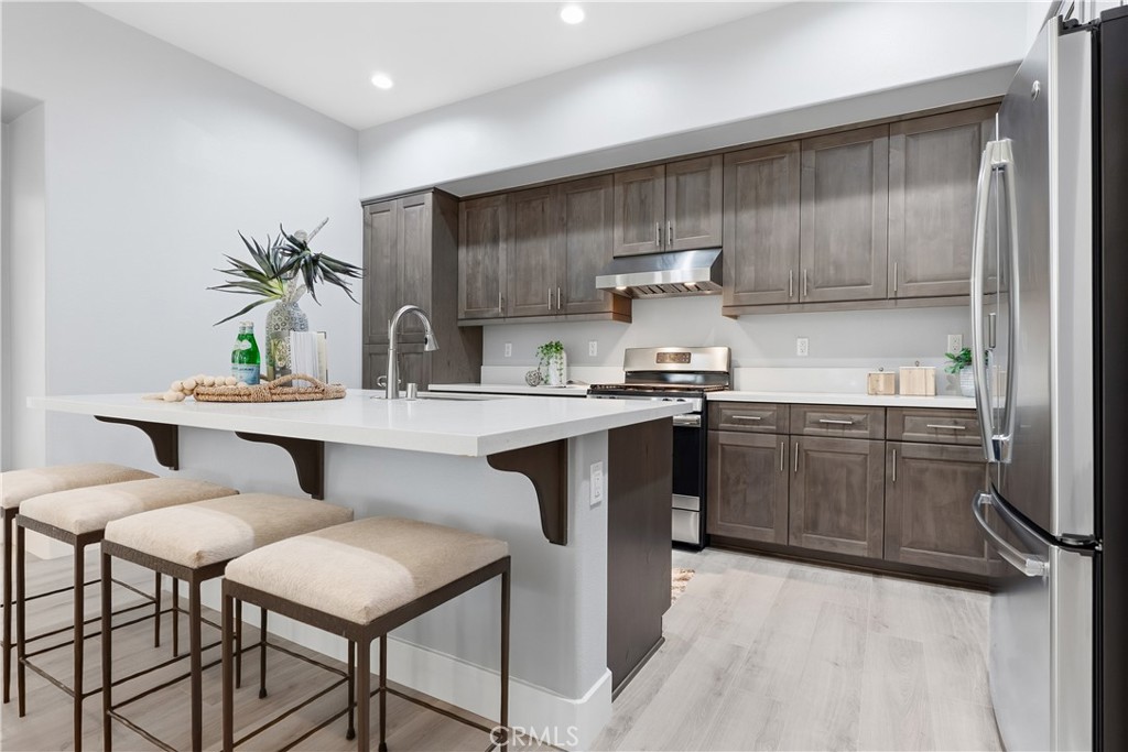67 Promesa Avenue Rancho Mission Viejo, CA 92694 - Photo 5 of 75 a kitchen with a sink appliances and cabinets