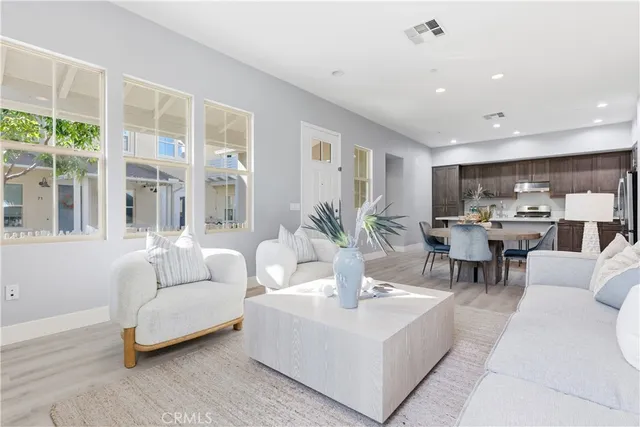 a view of a chair and tables in the backyard