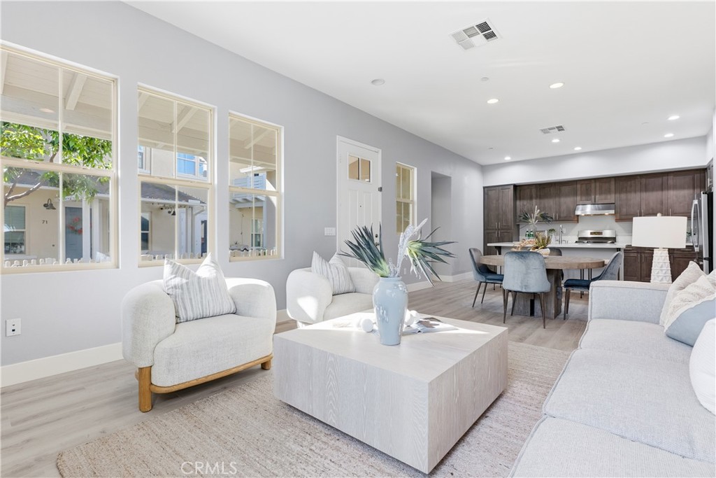 67 Promesa Avenue Rancho Mission Viejo, CA 92694 - Photo 10 of 75 a living room with furniture and a large window