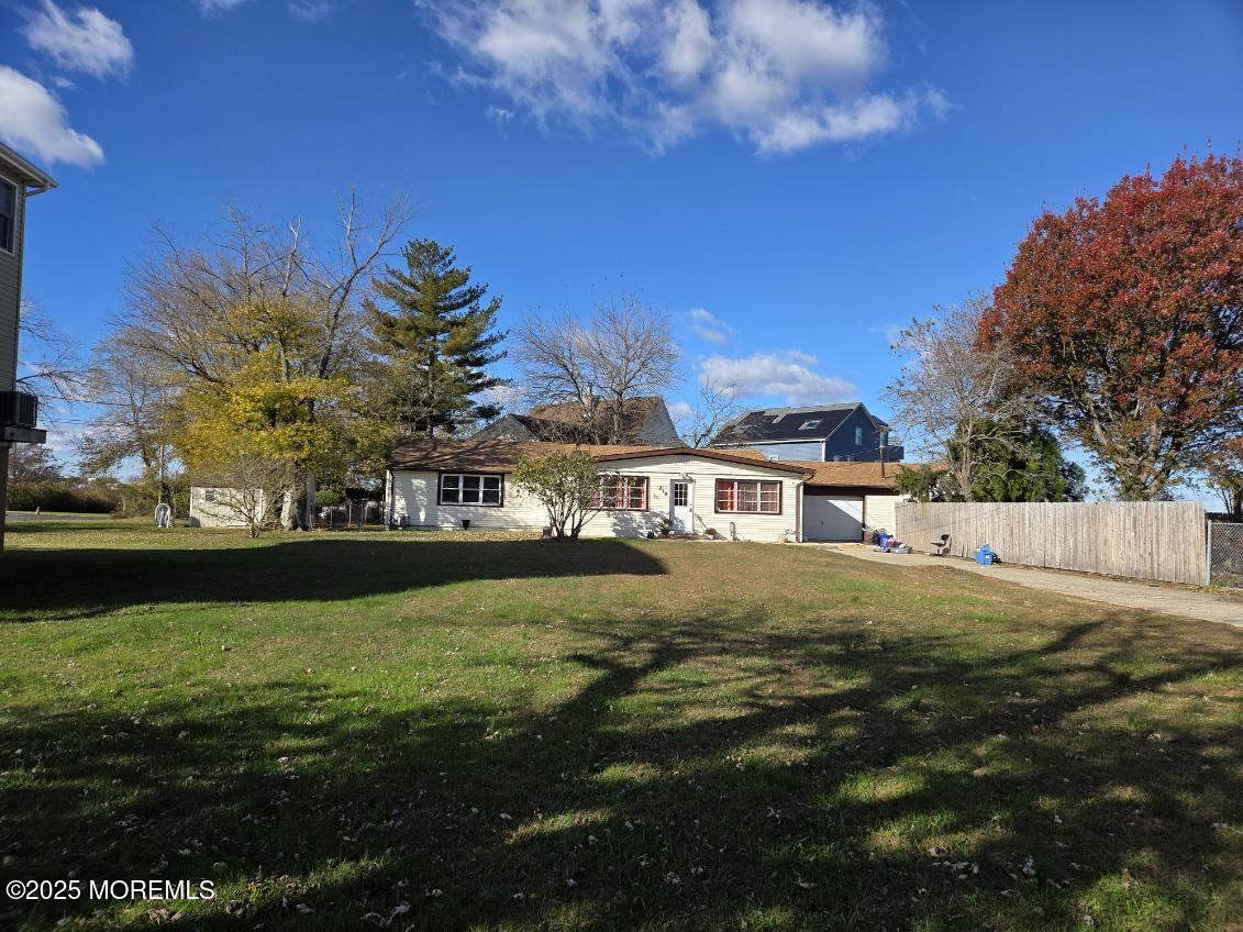 a view of swimming pool is middle in the garden