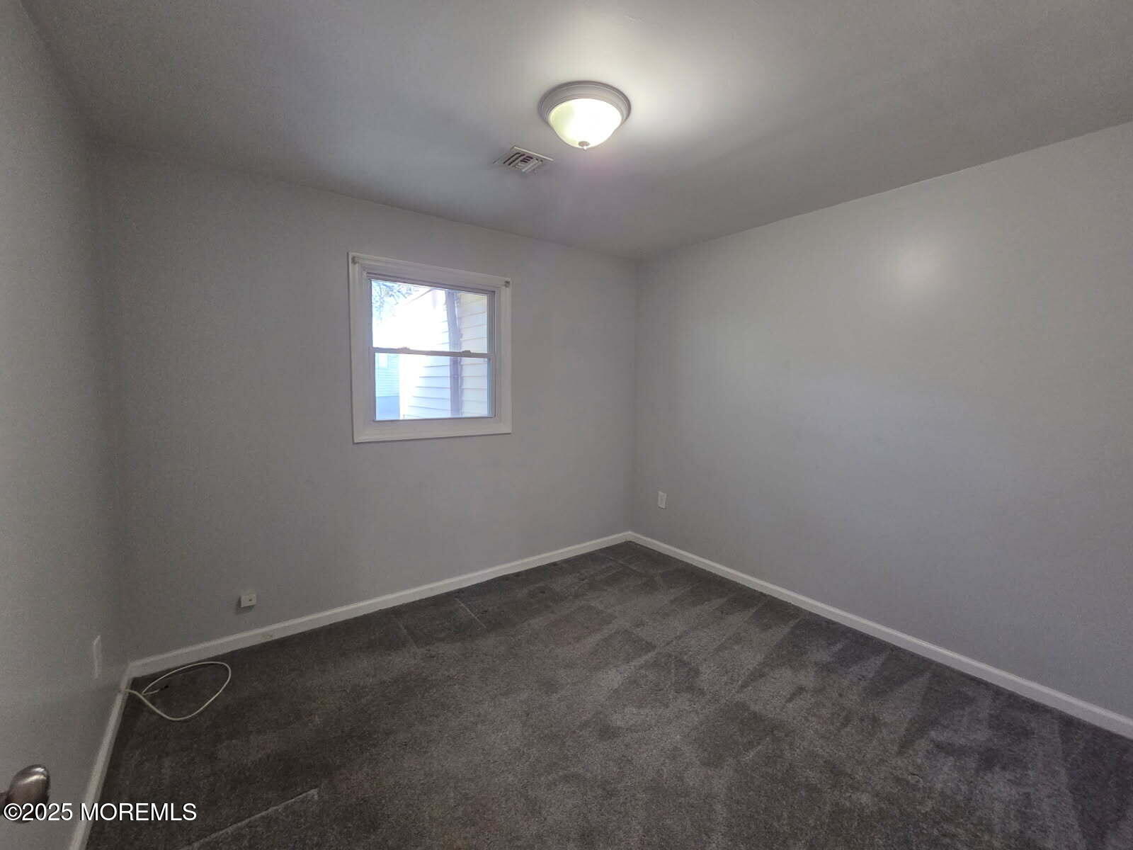 219 Dock Street Union Beach, NJ 07735 - Photo 17 of 22 an empty room with a window