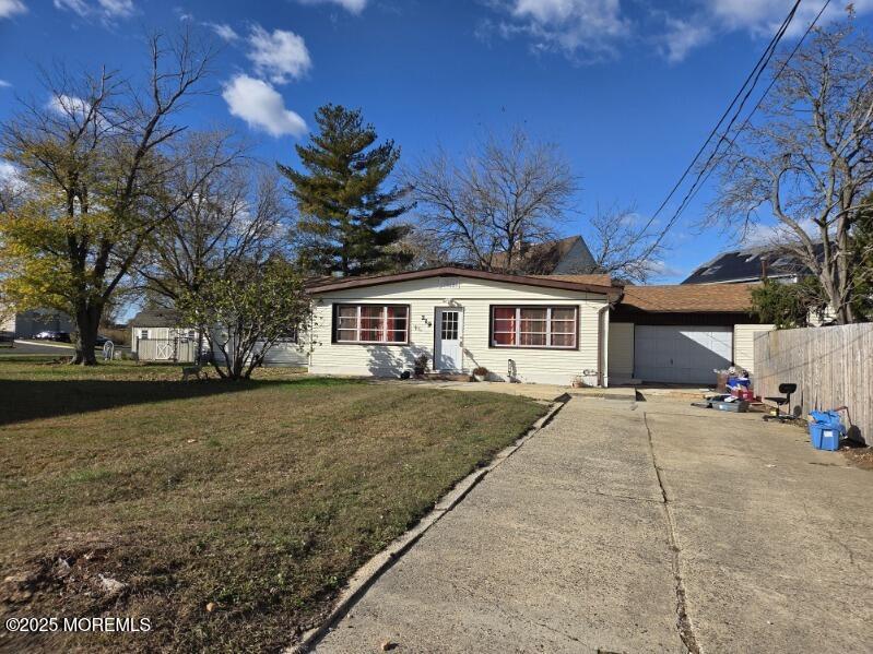 219 Dock Street Union Beach, NJ 07735 - Photo 21 of 22 a front view of a house with a garden and trees