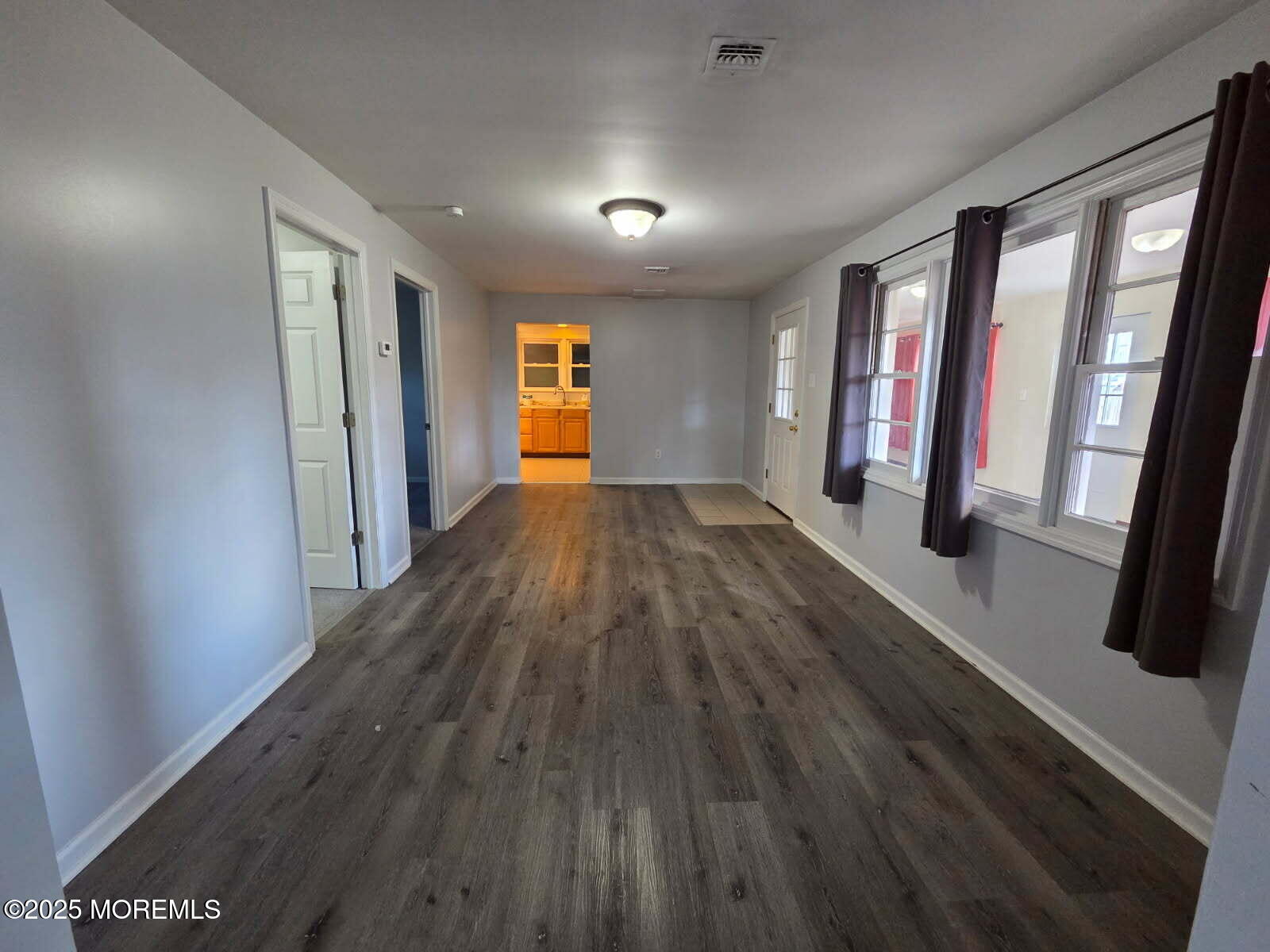 219 Dock Street Union Beach, NJ 07735 - Photo 6 of 22 wooden floor in an empty room with a window